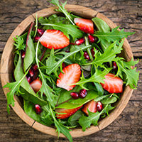 photo of a strawberry-arugula salad